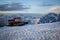 Snow tractor in the rays of sunset on the slopes of Mount Elbrus