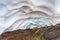 The snow tunnel Lesser Valley of Geysers in June, Kamchatka Peninsula, Russia