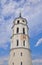 Snow-white bell tower in Vilnius on the background of blue sky