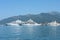 Snow-white, huge yachts in Boka-Kotor bay of the Adriatic Sea against the background of mountains and blue sky, Montenegro, Europe