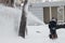 Snowblower, a man cleans the snow