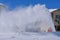 Snowblower shoots a cloud of snow