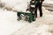 A snowblower in winter, view from the front side