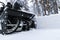 Snowblower at work on a winter day. Removing snow after blizzard snowfall. Clearing the ice. A snow blower is clearing a driveway