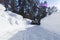 Snowblower at work on a winter day. Snowplow removing snow after blizzard. Clearing the ice. Snow removal machine. Clear driveway