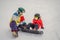 Snowboard instructor teaches a boy to snowboarding. Activities for children in winter. Children`s winter sport