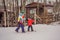 Snowboard instructor teaches a boy to snowboarding. Activities for children in winter. Children`s winter sport