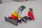 Snowboard instructor teaches a boy to snowboarding. Activities for children in winter. Children`s winter sport