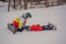 Snowboard instructor teaches a boy to snowboarding. Activities for children in winter. Children`s winter sport