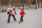 Snowboard instructor teaches a boy to snowboarding. Activities for children in winter. Children`s winter sport