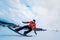 Snowboarder in a black helmet riding on a snowy track.