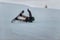 Snowboarder in a black helmet riding on a snowy track.