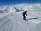 Snowboarder in black suit on board on snowy mountains. Winter sport concept. Active lifestyle background.
