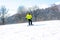 Snowboarder descends a steep slope from a mountain