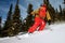 Snowboarder doing a toe side carve.