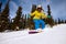 Snowboarder doing a toe side carve