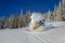 Snowboarder doing a toe side carve