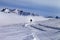 Snowboarder downhill on off-piste slope with newly-fallen snow