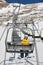 Snowboarder elevating on chairlift