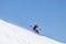 Snowboarder enjoying runs and jumps on spring`s last snow.