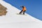 Snowboarder enjoying runs and jumps on spring`s last snow.