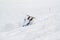 Snowboarder fall down with snow splashes