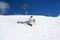 Snowboarder fall down with snow splashes on snowy off-piste ski slope