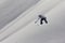 Snowboarder flying on the background of snowy slope. Extreme winter sports, snowboarding.