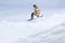 Snowboarder flying on the background of snowy slope. Extreme winter sports, snowboarding.