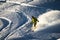 Snowboarder in fresh powder at sunset