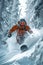 snowboarder going down a snow-covered slope in the middle of a white forest