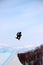 Snowboarder going off a big jump in hanazono park