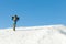 Snowboarder in helmet taking a walk to the top of a mountain