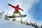 Snowboarder jumping