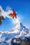 Snowboarder jumping against Matterhorn peak in Switzerland