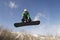 Snowboarder Jumping Against Sky