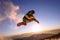 Snowboarder jumping through air