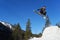 Snowboarder jumping high