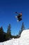 Snowboarder jumping high