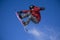 Snowboarder jumping high