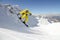Snowboarder jumping on mountains. Extreme snowboard freeride sport.