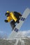 Snowboarder In Jumping While Showing Victory Sign Against Sky