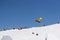 Snowboarder jumps in Snow Park