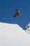 Snowboarder jumps in Snow Park, ski resort