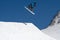 Snowboarder jumps in Snow Park, ski resort