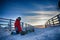 Snowboarder on the mountain in the evening at sunset.