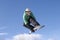 Snowboarder Performing Stunt Against Blue Sky
