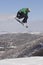 Snowboarder Performing Stunts On Snowy Hill