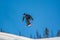 Snowboarder pulling tricks on the Colorado Rockies slopes