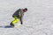 Snowboarder quickly rolls down the mountain on loose snow